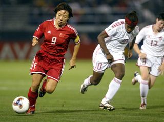 Sun Wen #9 of China heads up field during game action at PGE Park in Portland, Oregon, October 2, 2003. Canada defeated China 1-0 in The 2003 Women's World Cup Quarterfinal. (Photo by Tom Hauck/Getty Images)
