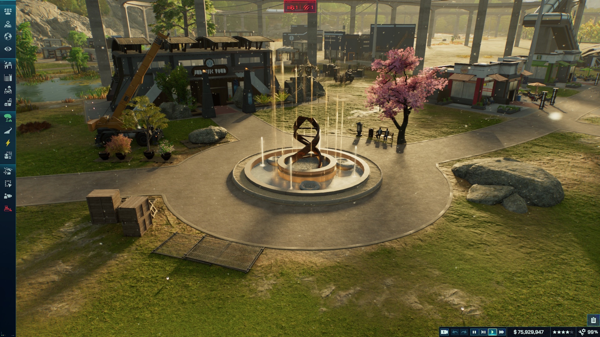 A fountain featuring a DNA double helix statue surrounded by jets of water at the middle of a roundabout in Jurassic World Evolution 3.