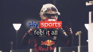 A Sky Sports logo in front of a Red Bull F1 racing driver