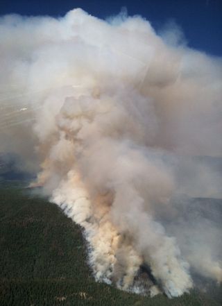 Fire activity builds in the Sand Creek drainage.