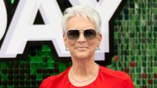 Jamie Lee Curtis wearing red cape dress at the Freakier Friday UK Premiere on July 31, 2025