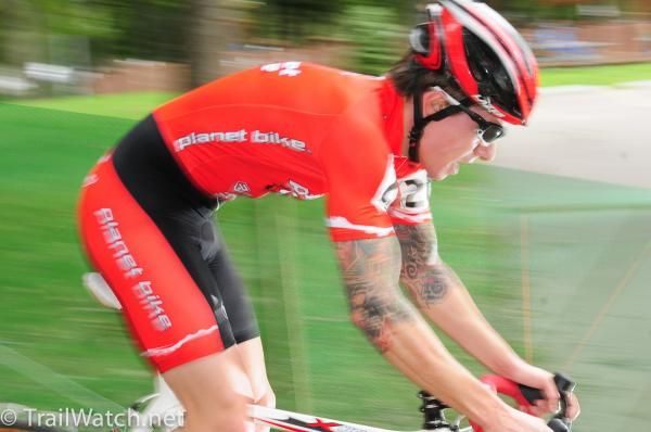 A Planet Bike rider streaks down a descent