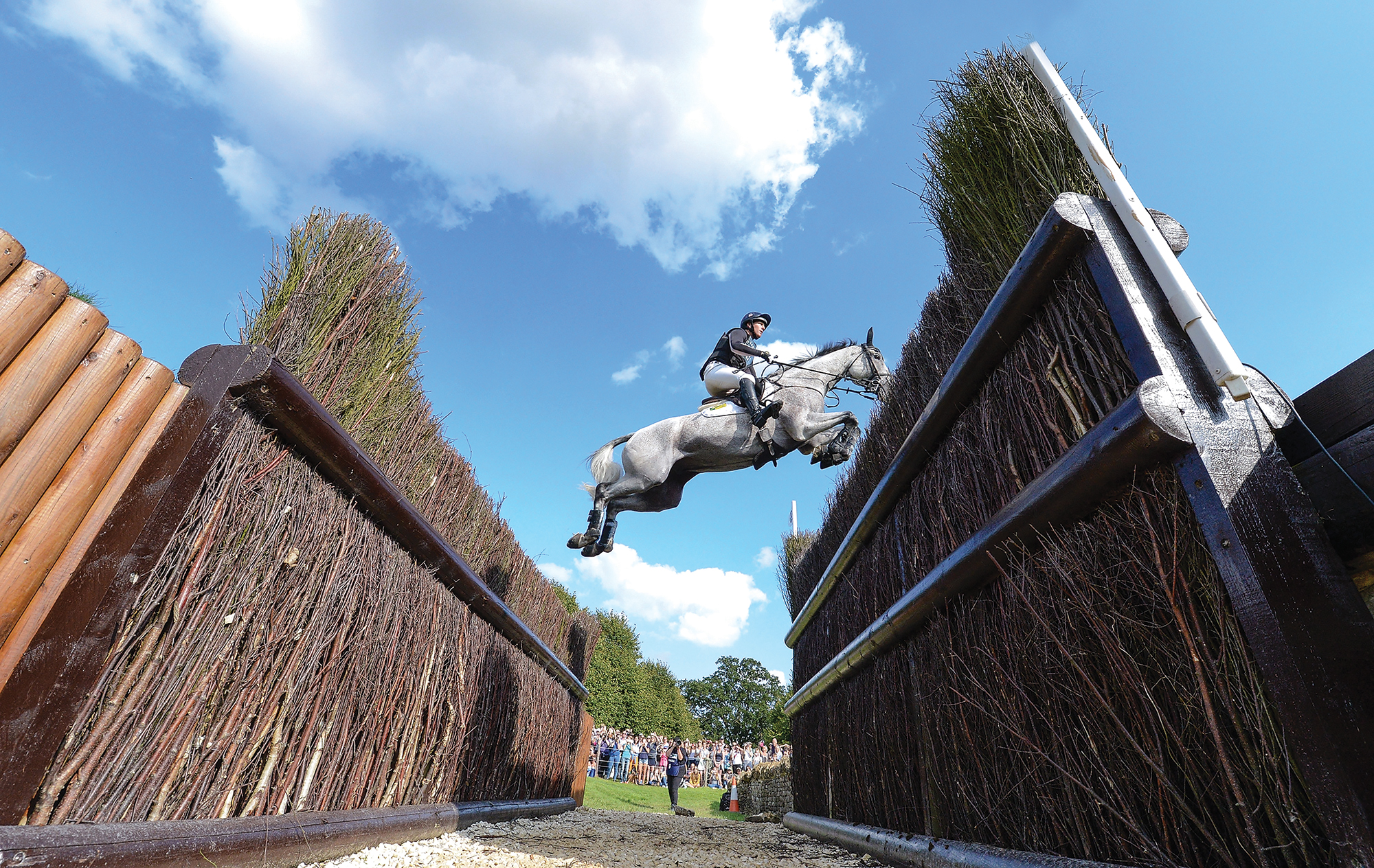 Oliver Townend and Ballaghmor Class soar over the Cottesmore leap at Burghley 2017