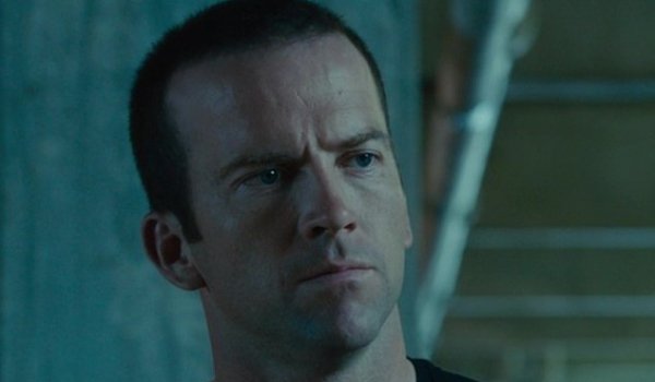 Furious 7 Sean in a parking garage with a serious look on his face