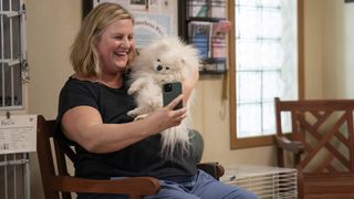 Bridget Everett holding a dog in Somebody Somewhere season 3