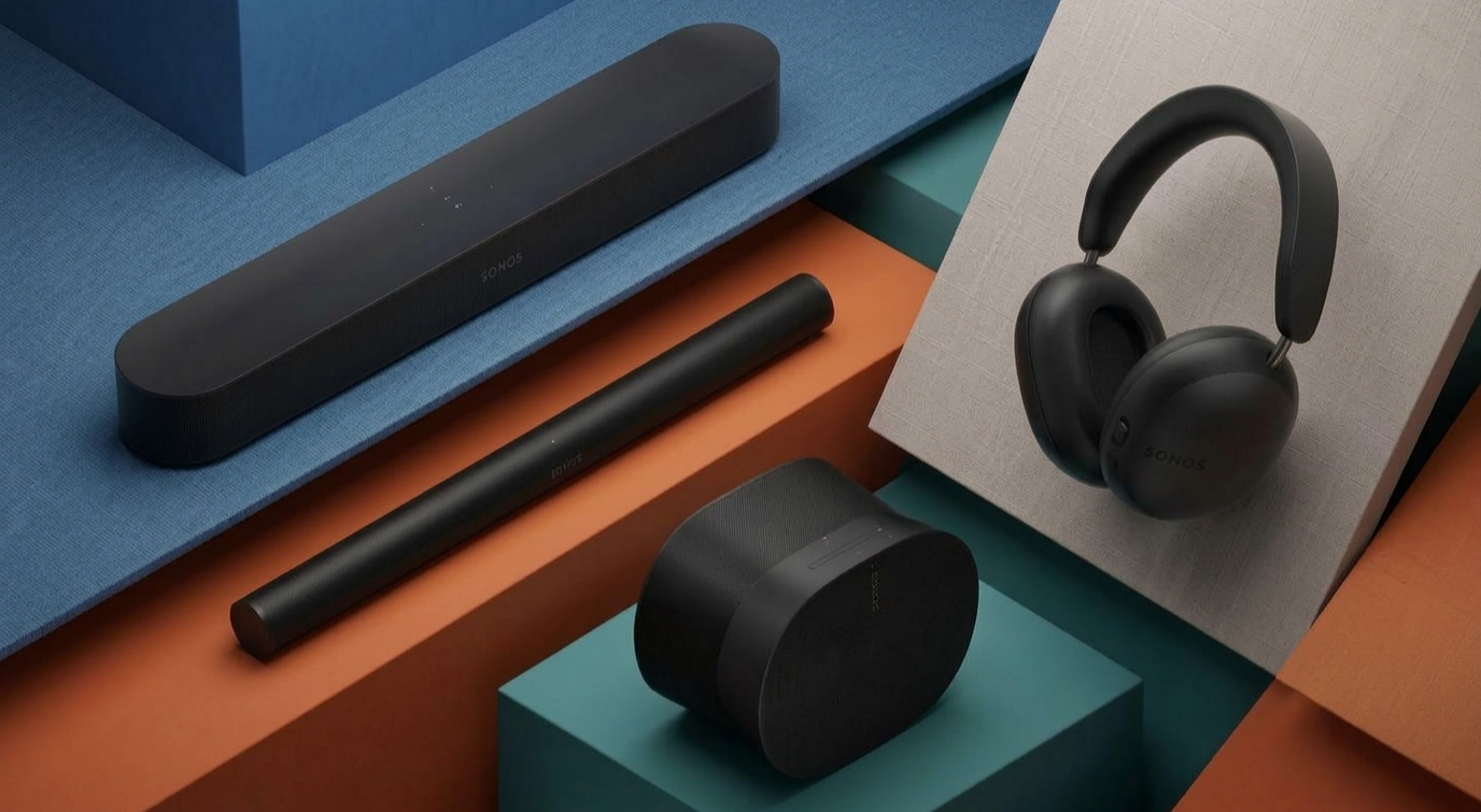 A collage of Sonos tech placed on multi-colored platforms, including the Beam Gen 2 soundbar, Arc Ultra soundbar, Era 300 speaker and Ace headphones.