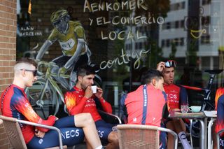 Ineos Grenadiers riders take a break during a 2023 training ride