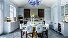 large kitchen with pale blue and dark wooden cabinetry