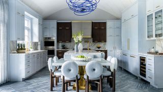 large kitchen with pale blue and dark wooden cabinetry