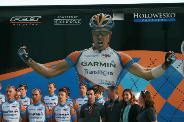 Tyler Farrar looms large in the background on the team's bus.
