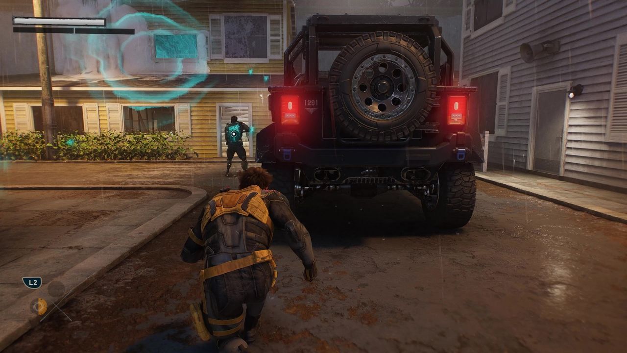 Logan crouch walks in stealth towards an unaware enemy in Marvel's Wolverine, from the our Big Preview b-roll, in a training area made up to look like an American smalltown suburb