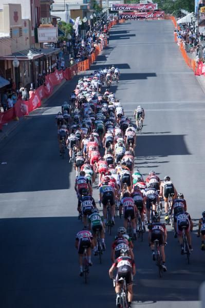 The bunch heads down the long finishing straight