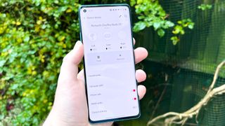 A OnePlus 8 smartphone with the options for the OnePlus Buds Z2 on screen