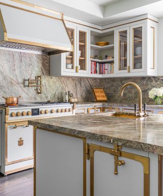 modern kitchen with marble island and countertops