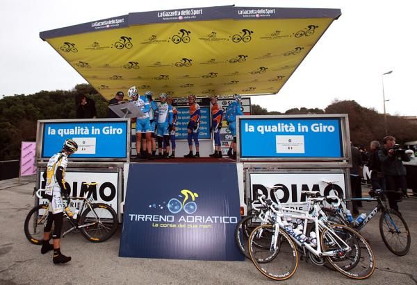 The riders sign in under the canopy.