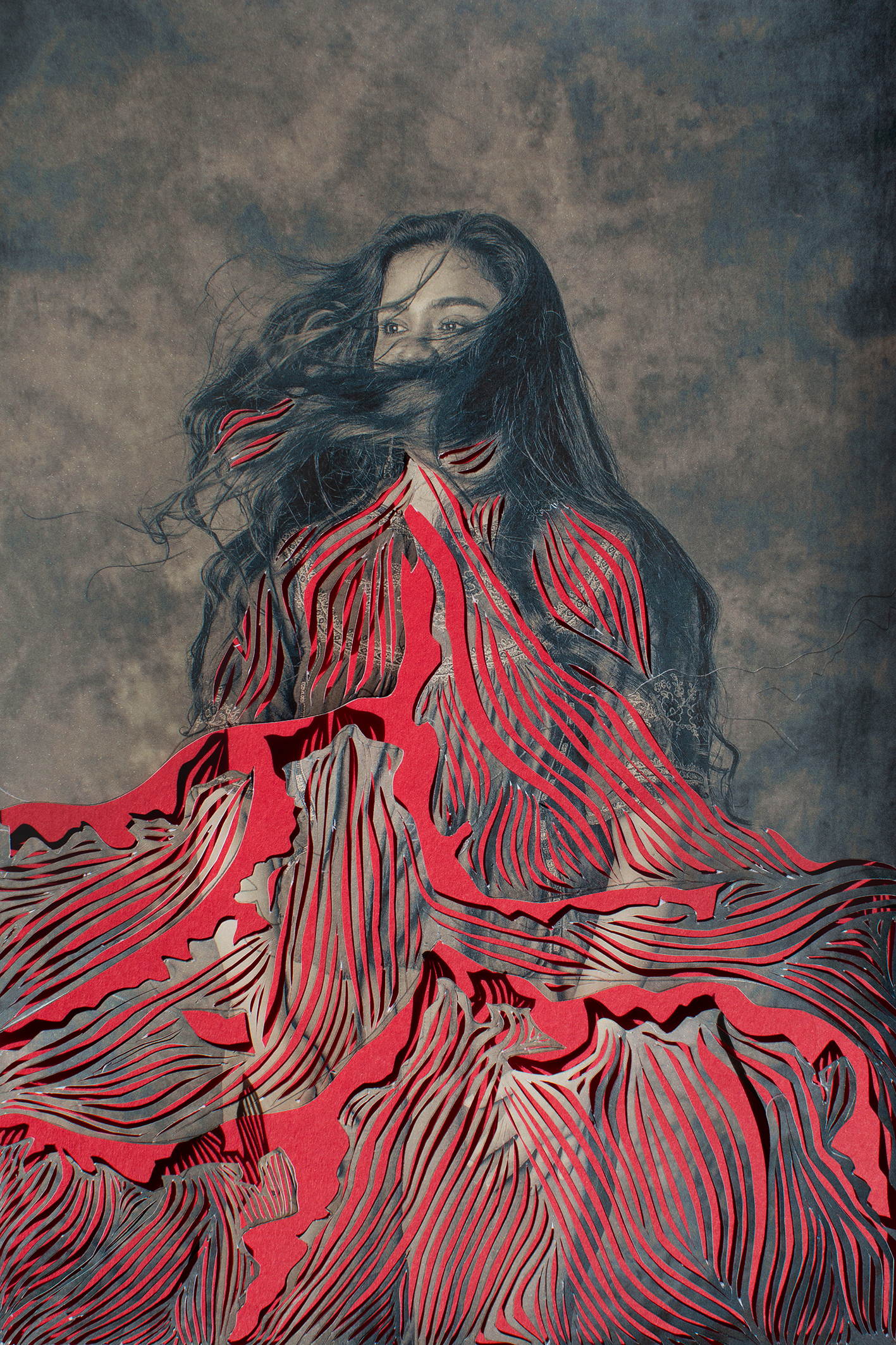 A flowing red cut-paper gown with intricate patterns surrounds a figure against a textured background, creating an ethereal effect