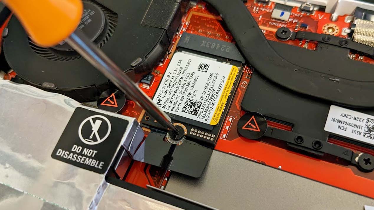 Unscrew the M2 screw that holds the ROG Ally's SSD in place.