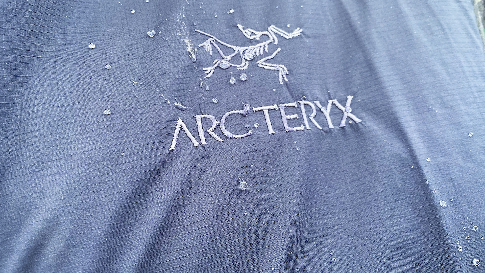 Arcteryx Atom Vest logo with water droplets
