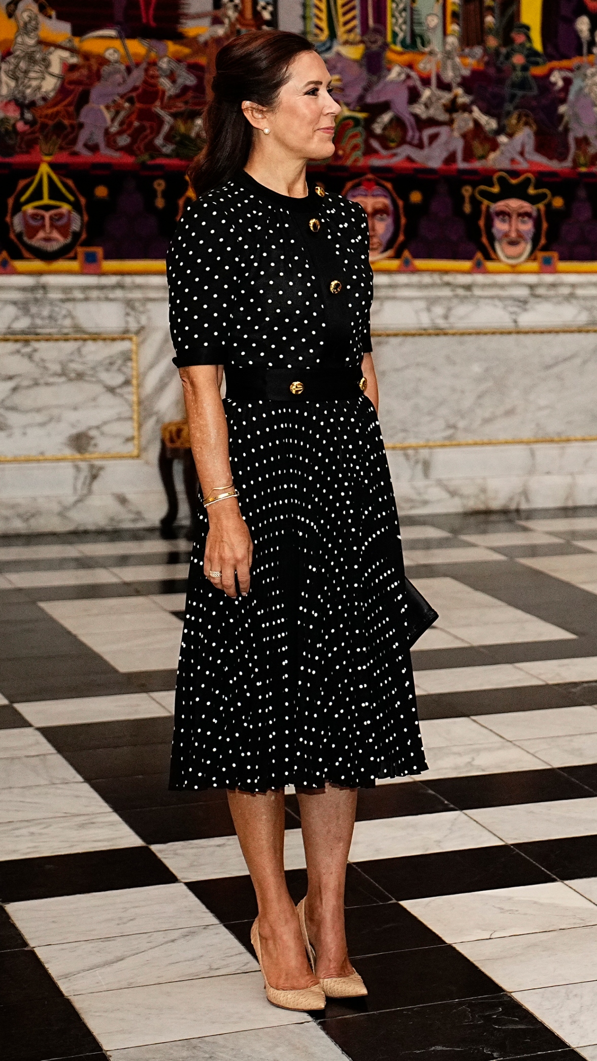Queen Mary of Denmark stands in the Hall of Knights at Christiansborg Castle in Copenhagen, Denmark on August 21, 2023