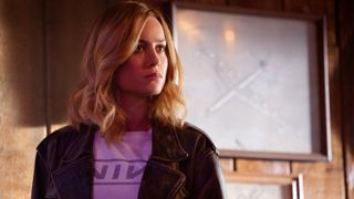 Carol Danvers (Brie Larson) visits Pancho's Bar in "Captain Marvel" (2019). A vintage aeronautic photo can be seen in the background.