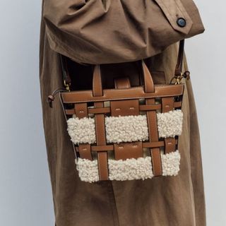 shearling and faux leather cut out bag