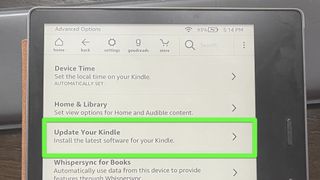 A Kindle Oasis with "Update Your Kindle" highlighted on the Advanced Options screen