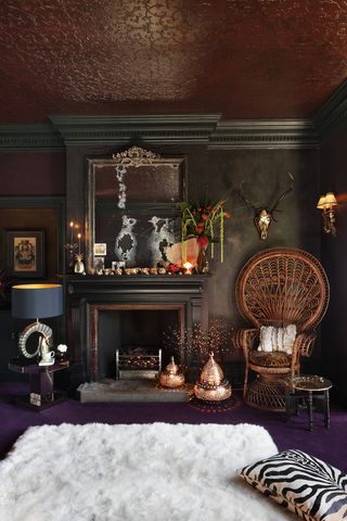 Dark living room with black walls, dark red ceiling and purple floors