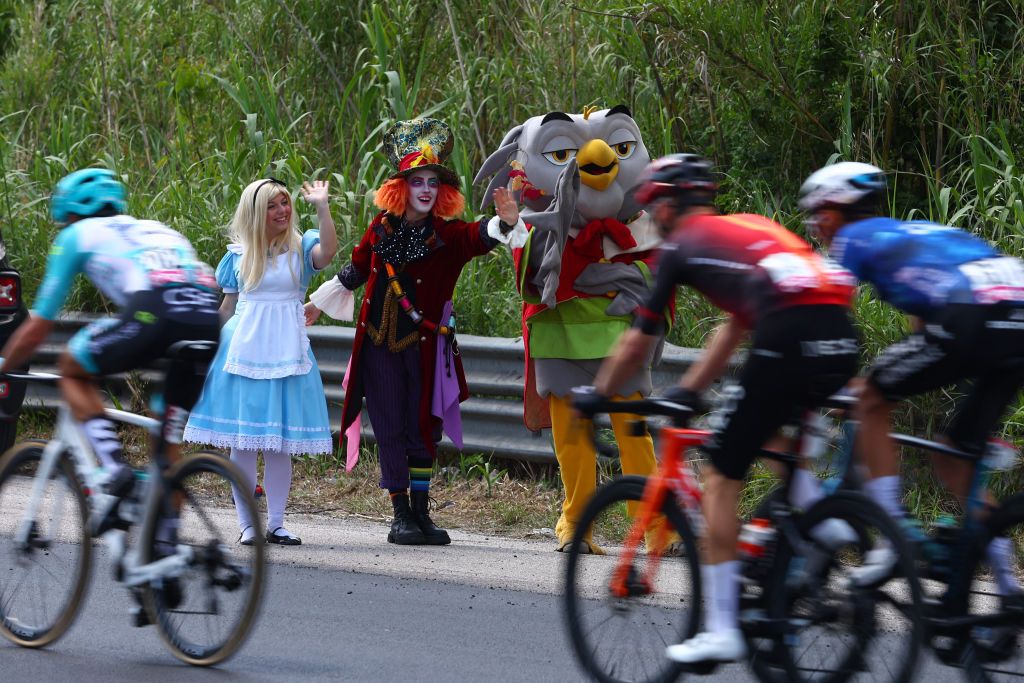 Fans wave to riders near Cassino