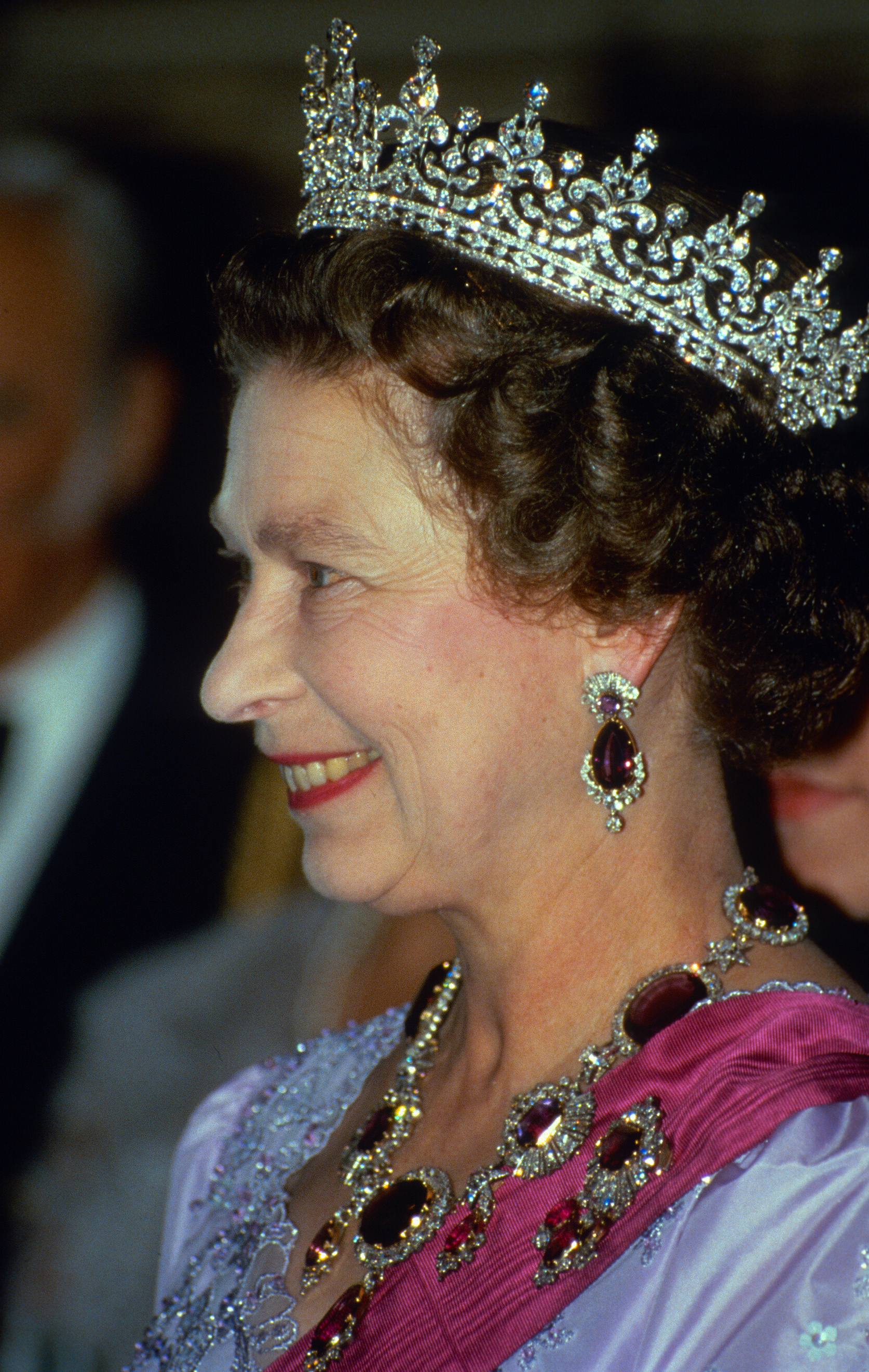Profile photograph of Elizabeth II wearing a tiara and matching amethyst earrings necklace and brooch