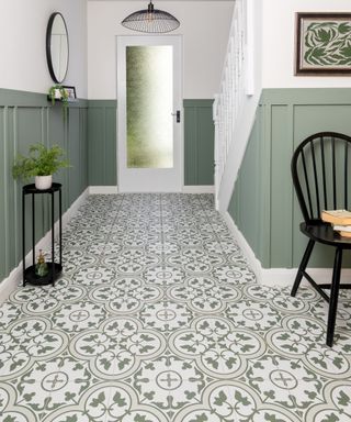 green and white floor tiles with green walls below dado level