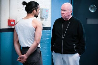 Ravi and Phil Mitchell in prison