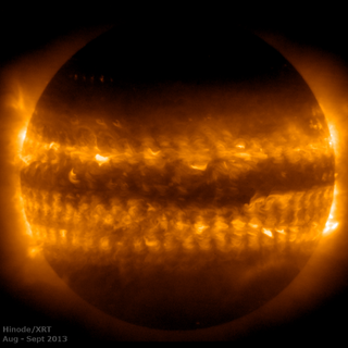 This image was created by combining 54 observations of the sun's outer atmosphere, called the corona, in 2013. The horizontal bands above and below the equator are "activity belts" that start closer to the poles and gradually move to low latitudes as the 11-year solar cycle progresses. The dark spaces are known as the quiet sun.