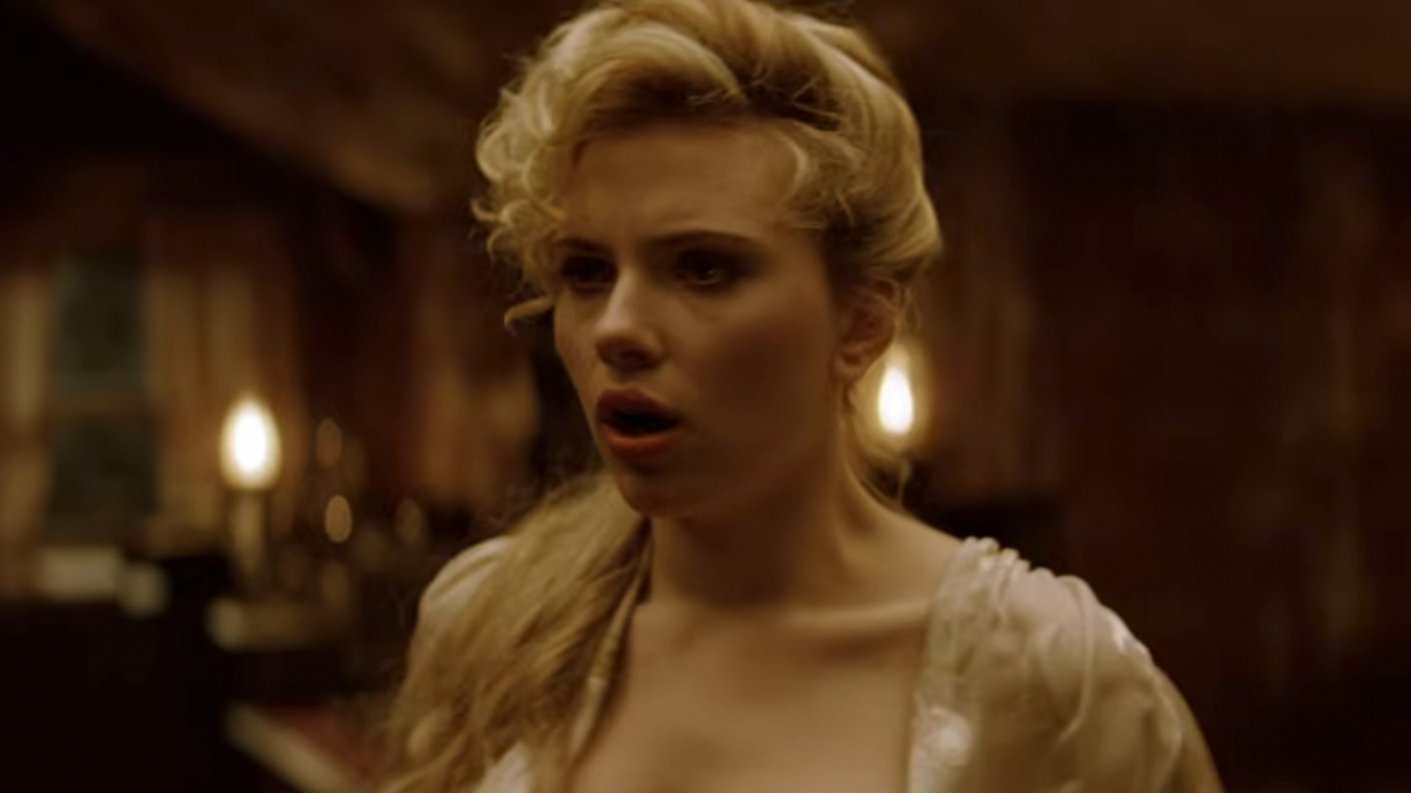 Scarlett Johansson in a white dress, looking surprised in The Prestige