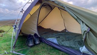 Hiking boots inside Robens Starlight 1 tent vestibule