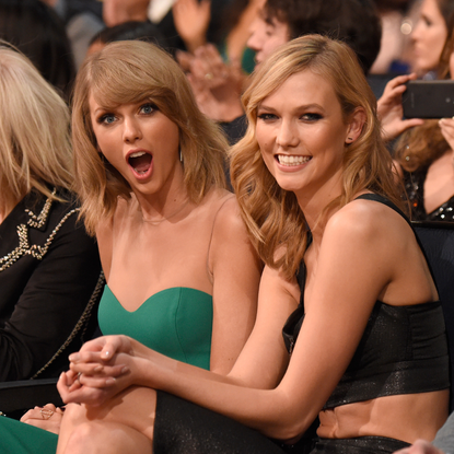 Karlie Kloss and Taylor Swift attend the 2014 American Music Awards at Nokia Theatre L.A. Live on November 23, 2014 in Los Angeles, California