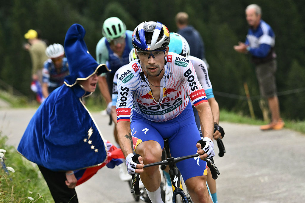 Red Bull - BORA - hansgrohe team's Slovenian rider Primoz Roglic cycles in the ascent of Col du Pre during the 19th stage of the 112th edition of the Tour de France cycling race, 93.1 km between Albertville and La Plagne, in the French Alps, on July 25, 2025. The 19th stage of the Tour de France was shorted from its initial 129.9 km route, bypassing the Col des Saisies where an outbreak of nodular dermatitis in a herd of cattle was discovered, prompting organizers to modify the race route. (Photo by Marco BERTORELLO / AFP) (Photo by MARCO BERTORELLO/AFP via Getty Images)