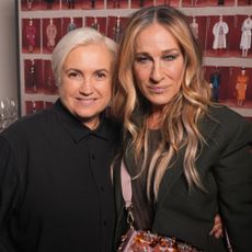 Sarah Jessica Parker poses with the creative director of Fendi while wearing a sequin Fendi bag