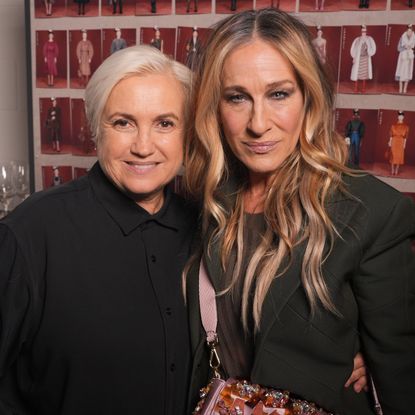 Sarah Jessica Parker poses with the creative director of Fendi while wearing a sequin Fendi bag