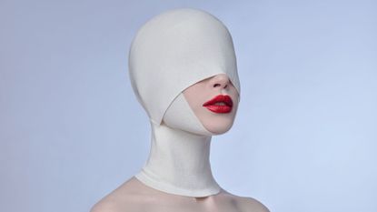 Woman with face bandaged