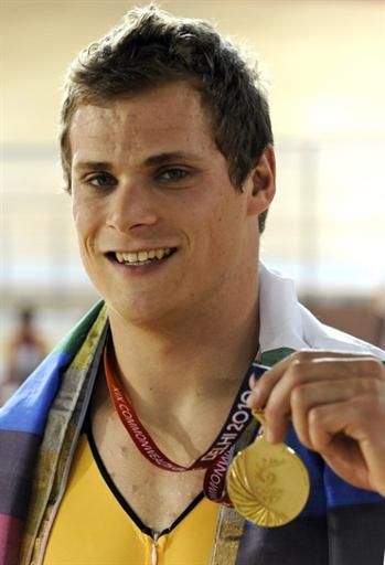 Scott Sunderland (Australia) shows off his gold medal for victory in the 1,000m time trial.