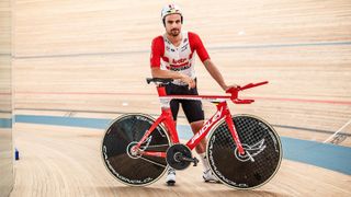 Victor Campenaerts stands with the Ridley Arena