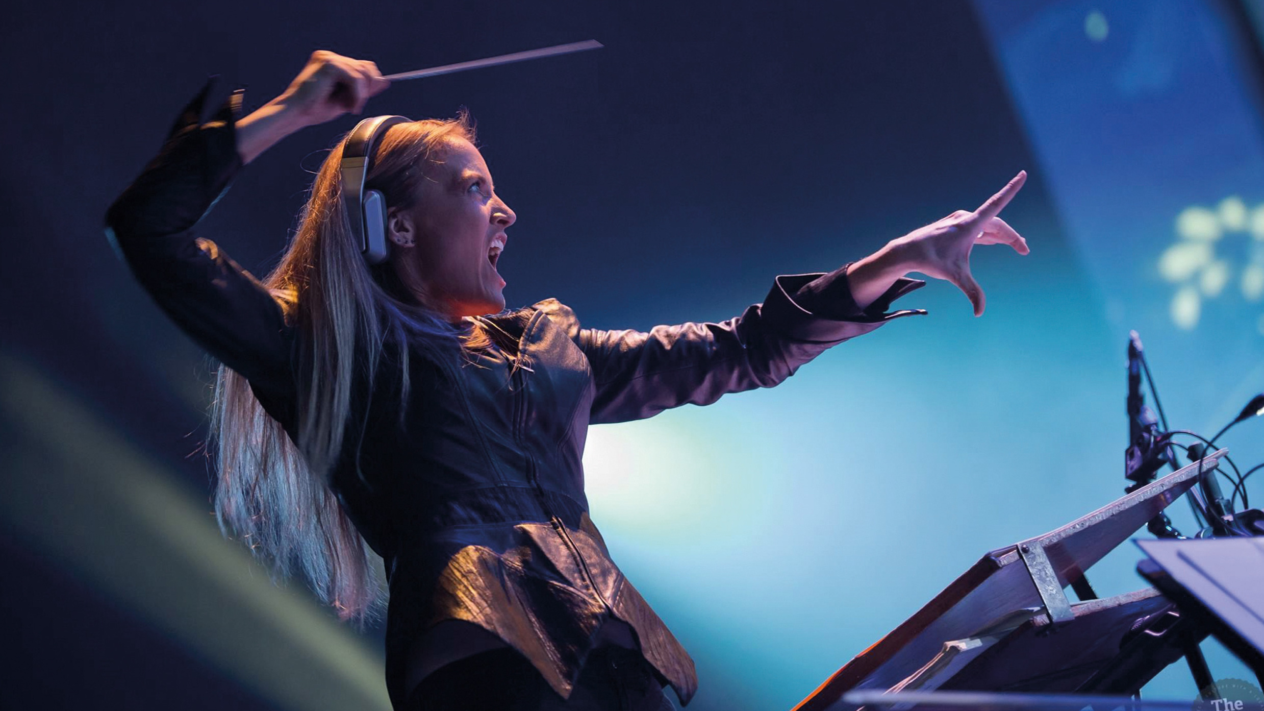 a woman tests out the Conductrix virtual baton