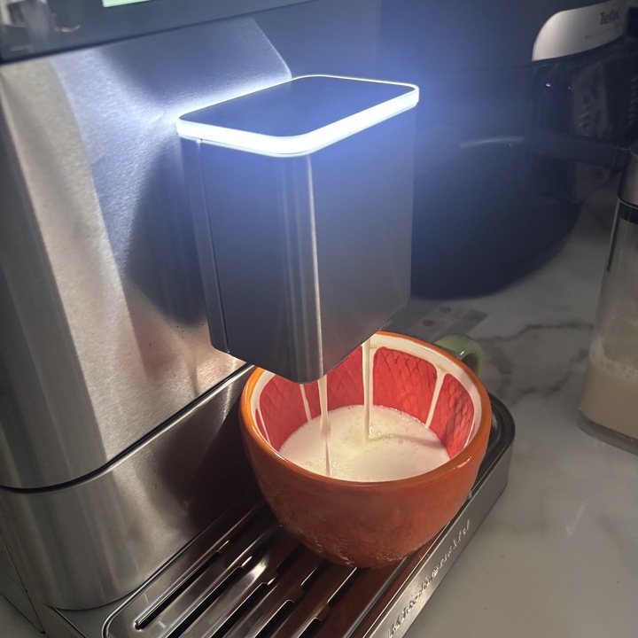 The KitchenAid Fully Automatic Espresso Machine KF8 creating a cappuccino.