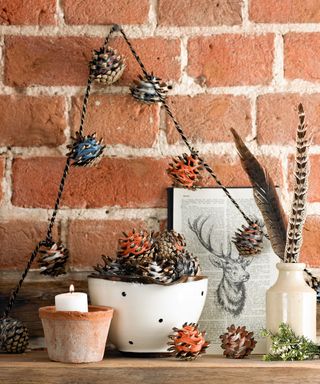 Pinecones on garland wrapped with colored yarn