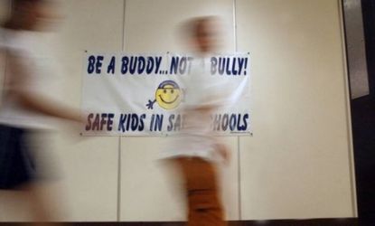 Students at Valley Elementary School in Bensalem, Pa., walk past a banner explaining the school's anti-bullying program: Two teachers at a San Antonio elementary school have received discipli