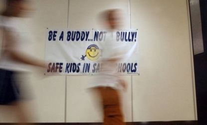 Students at Valley Elementary School in Bensalem, Pa., walk past a banner explaining the school&amp;#039;s anti-bullying program: Two teachers at a San Antonio elementary school have received discipli