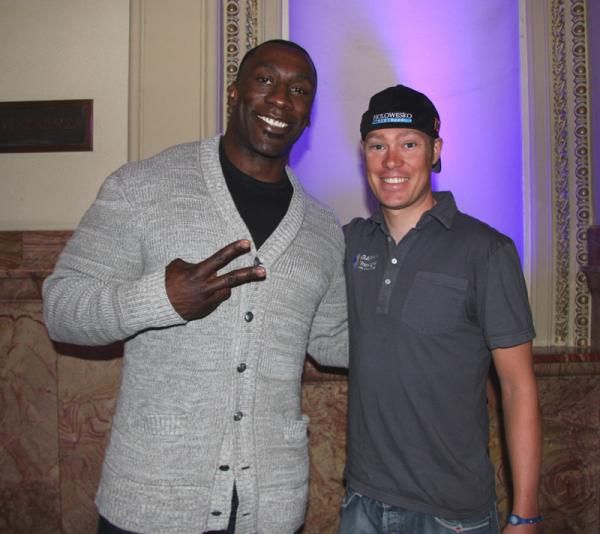 Shannon Sharpe, a pro football player from Colorado, poses with Tom Danielson