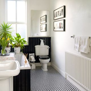 bathroom with white wall and washbasin and commode