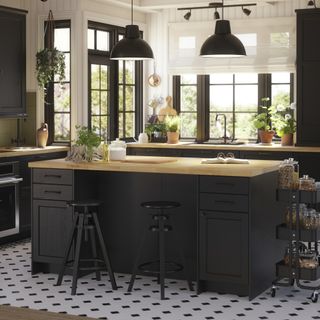 IKEA navy kitchen with island and wood worktops