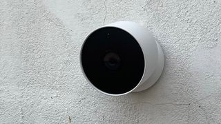 The Google Nest Cam (battery) mounted to a wall outside